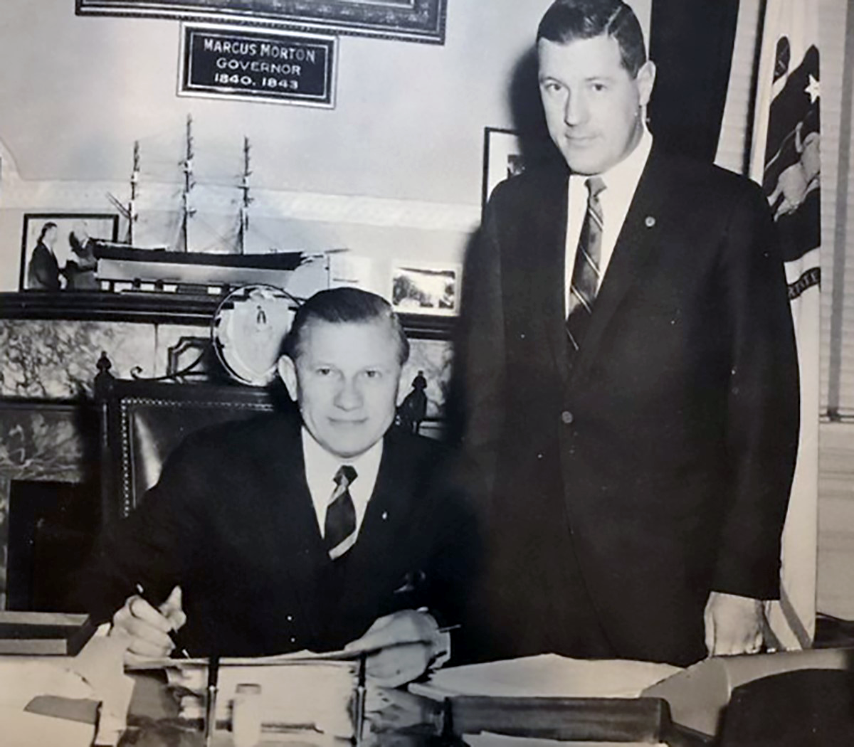 In November 1965, Governor John Volpe signed collective bargaining rights for teachers into Massachusetts law. Standing beside him is MTA Executive Secretary William H. Hebert.
