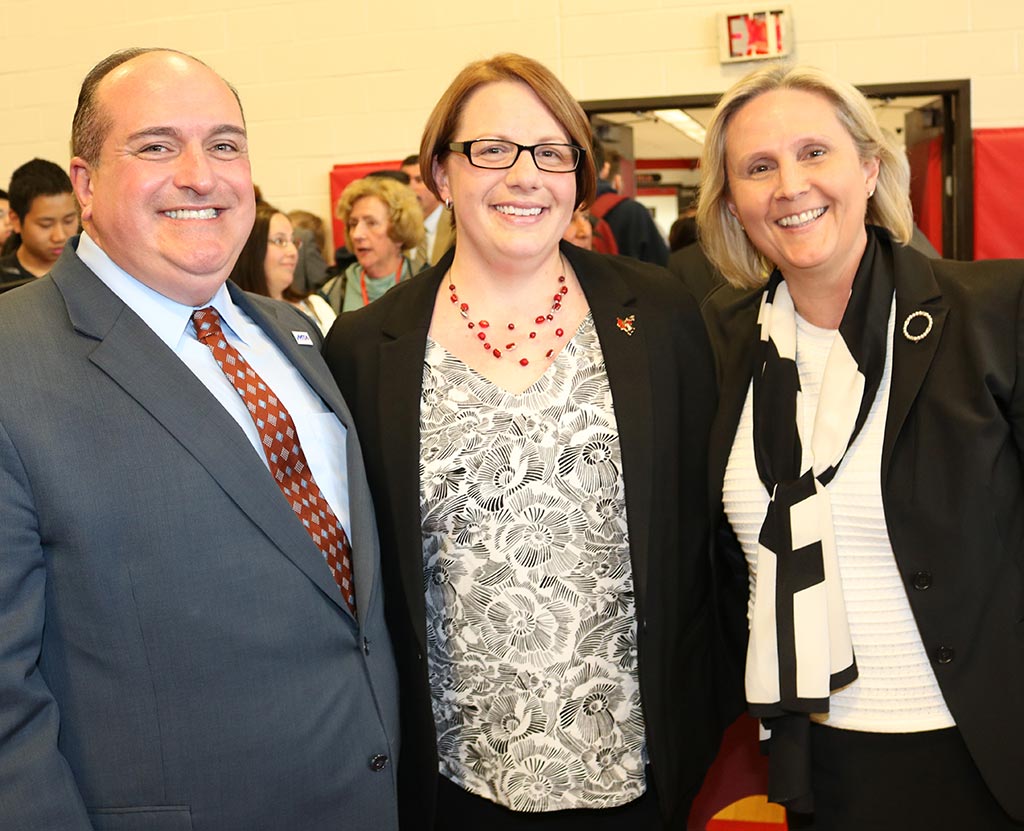 MTA Vice President Erik J. Champy, left, and Quincy Education Association President Allison Cox, right, were on hand to congratulate honoree Cara Pekarcik.