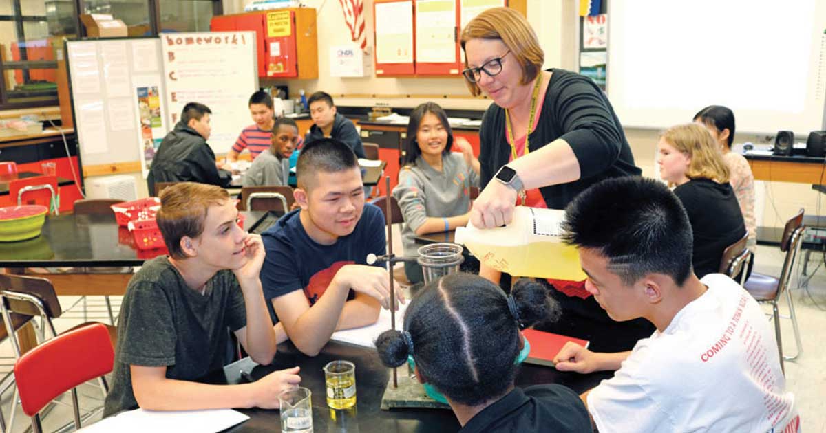 Science teacher Cara Pekarcik, the 2018 Massachusetts Teacher of the Year, worked with freshman and sophomore students during an honorslevel biology class at North Quincy High School recently as the students conducted an experiment to understand how the body regulates its vital functions. Pekarcik’s North Quincy High School classroom reflects her passion for ocean life.