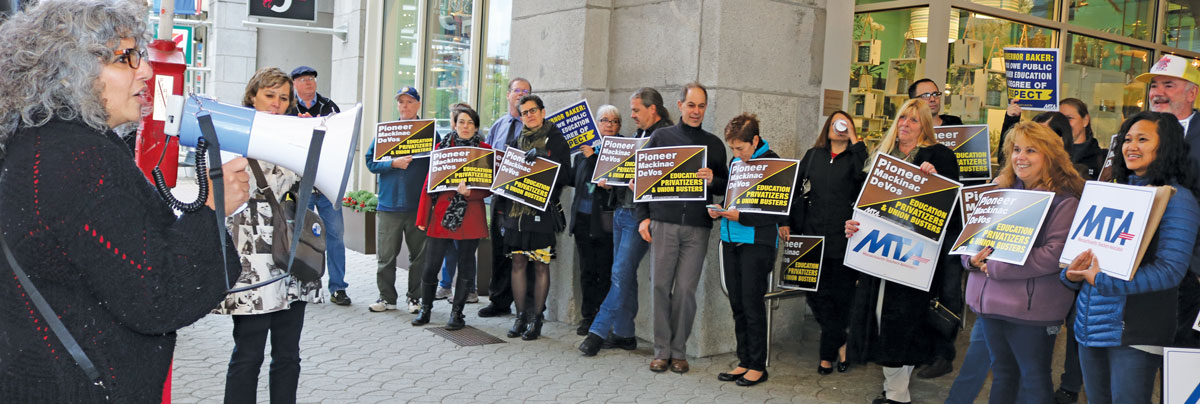 group of teachers protesting union busting 