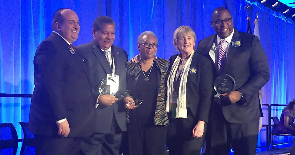 Vice President Erik J. Champy and President Barbara Madeloni congratulated, from left, Friend of Labor Juan Cofield, President’s Award winner Donna Bivens and Friend of Education Tito Jackson.