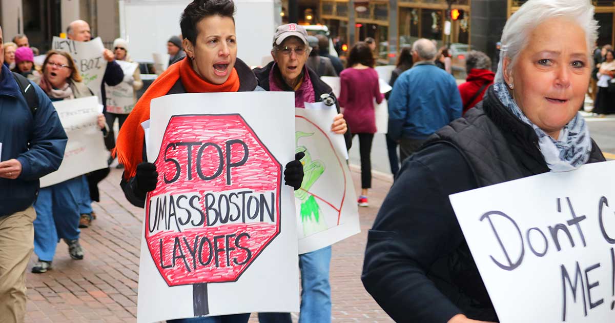 UMass Boston students, staff and faculty marched outside a UMass Board of Trustees finance committee meeting in downtown Boston. The crowd protested layoffs and deep budget cuts.